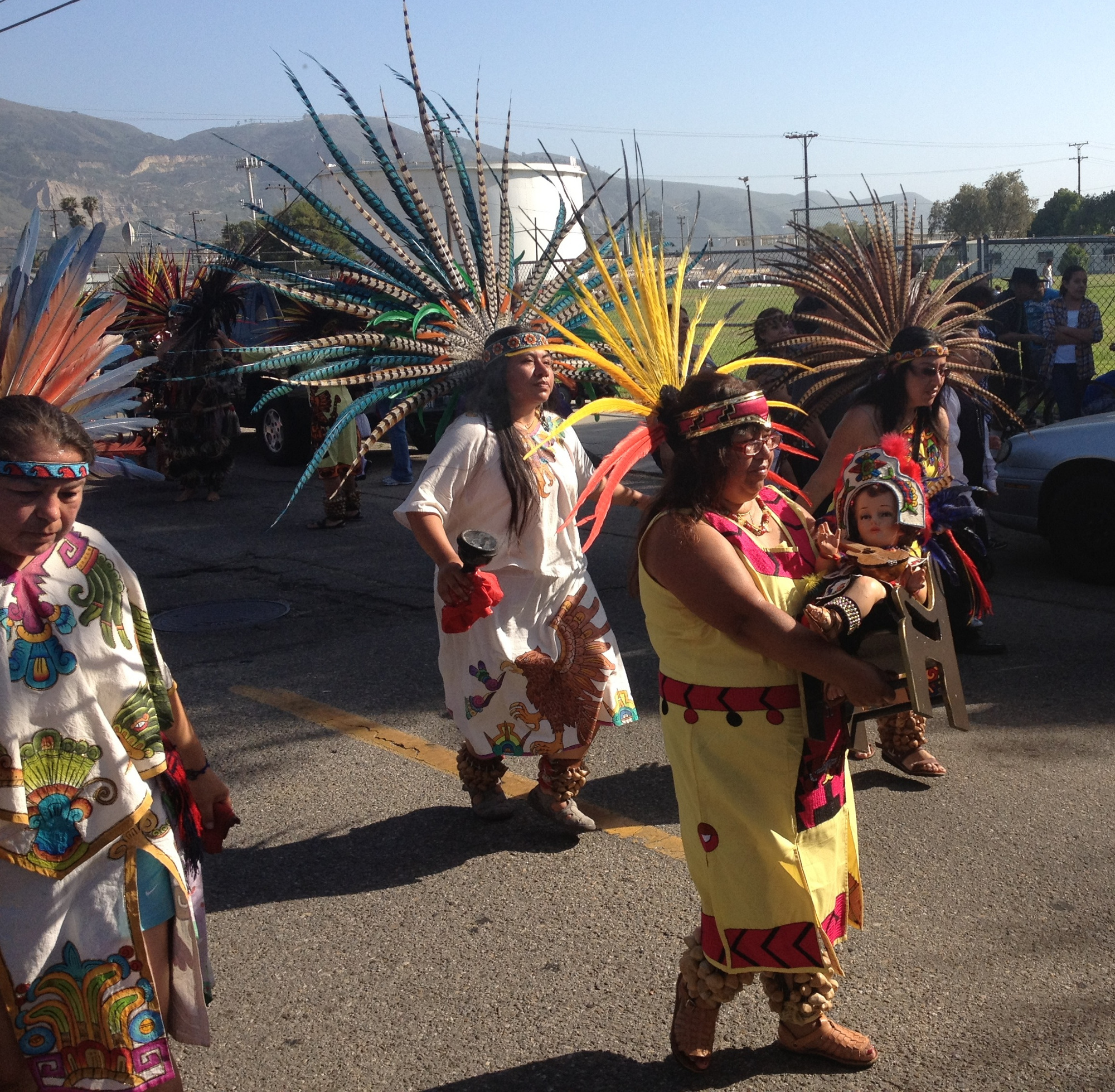 One of the many replicas of the Niño de Atocha included in the procession at Santa Paula, California, this one dressed in Aztec clothing.