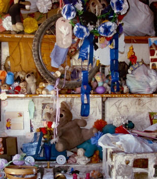 Shrine consisting children's toys and stuffed animals 