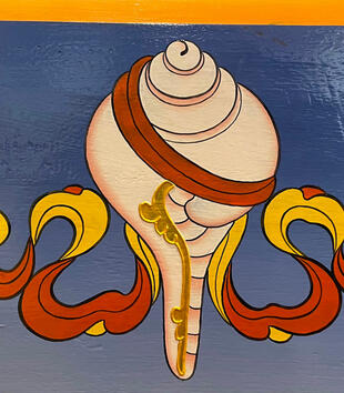 Painting of a conch shell against a plain blue background with red and yellow ribbon wrapped around it