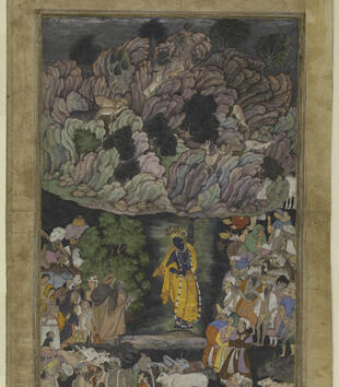 In a painting, a black-skinned Krishna in yellow robes and a crown holds up a craggy purple and gray mountains with one hand. Deers amble over the tree-lined range, and a crowd gathers on the ground watching Krishna at work. 