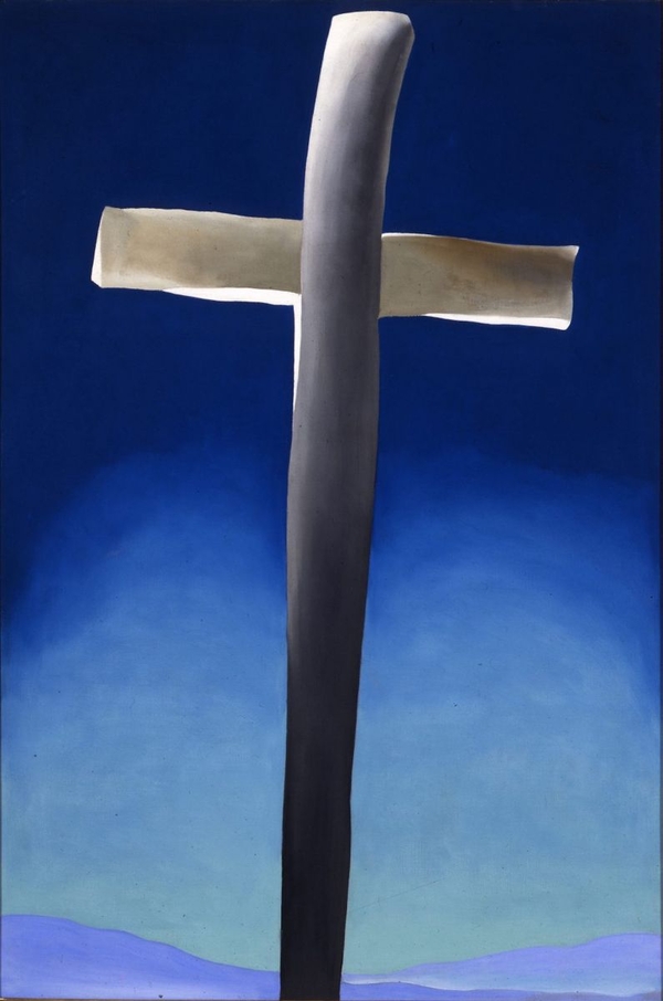 A geometic grey cross rises into a deep blue sky from a light blue band at bottom of the painting. The cross is lit up as if spotlit from some source outside the frame. 