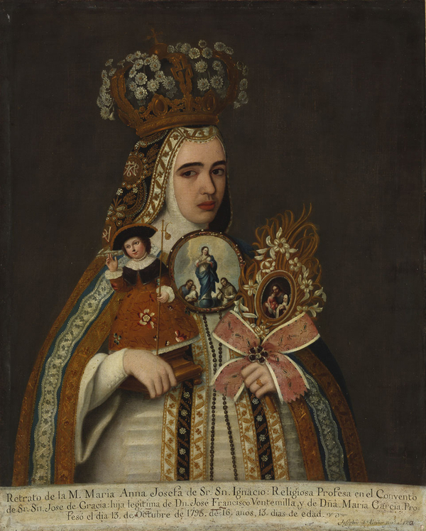 A young, light-skinned woman wearing an ornate gold crown and patterned cape looks out at the viewer in this oil painting. She holds an elaborately framed image of the Holy Family, a second portrait of Mary, and a small sculpture of Christ. 