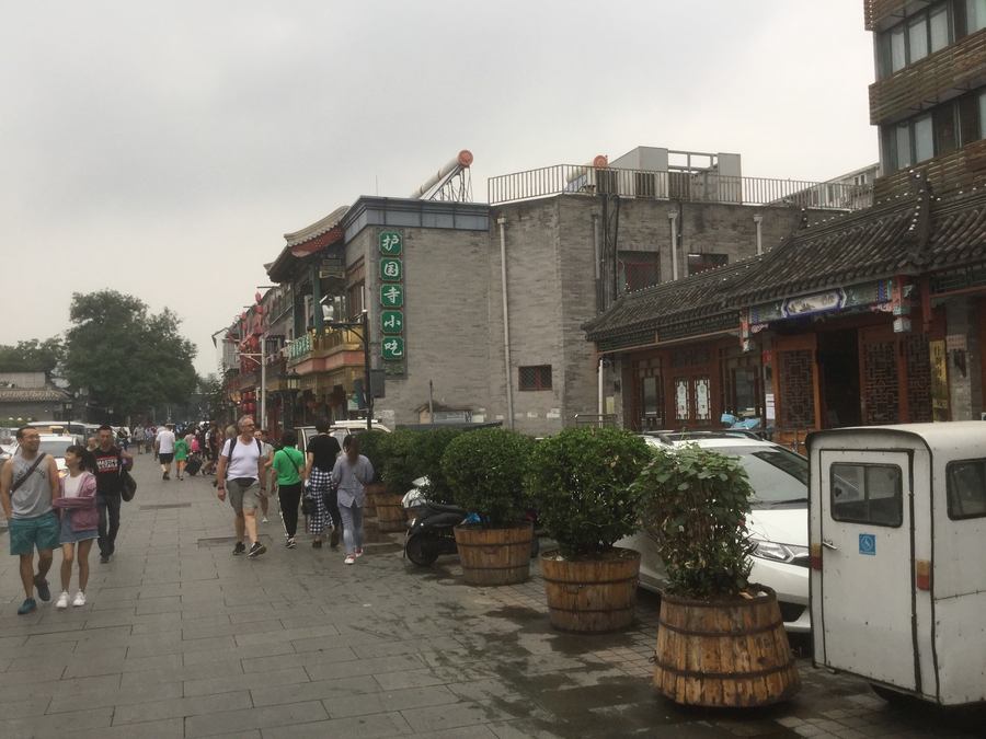 View of a street with a grey sky