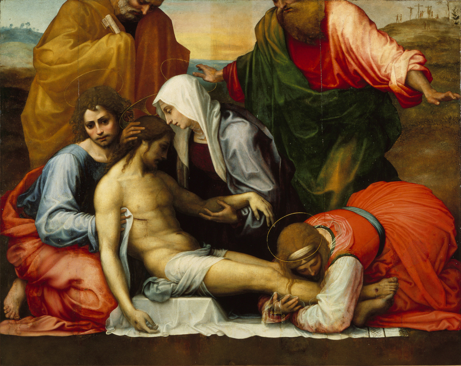 A lamenting group cradles a light-skinned, dead figure of Jesus in this detail of a painting. Two figures hold his head and chest. A woman in a red dress kneels and embraces his feet.