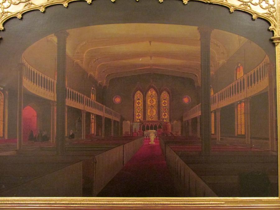 Painted from the perspective of a pew-lined aisle, a church interior appears warm and hazy from red carpets, glowing stained glass windows, and muted green-colored walls.