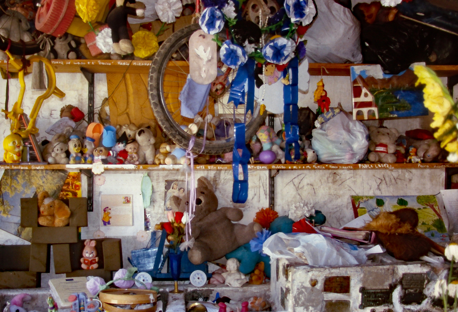 Shrine consisting of children's toys and stuffed animals 