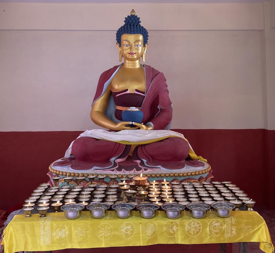Photograph of a colourful golden buddha statue